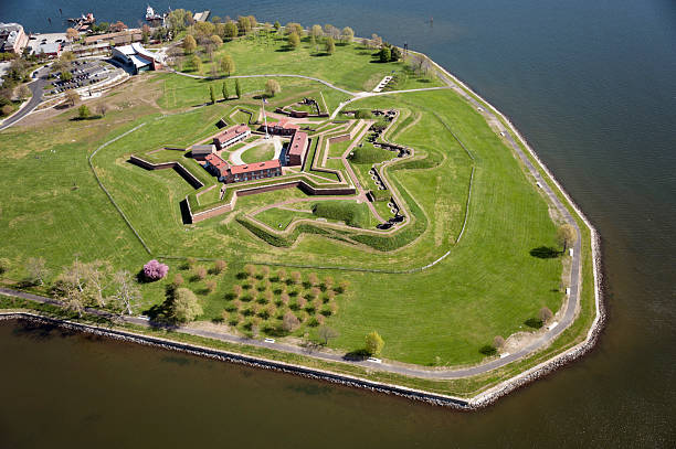 Aerial View of Fort McHenry National Monument "Baltimore, Maryland, USA aa April 7, 2012: Aerial shot of Fort McHenry, entrance to the Baltimore Inner Harbor." fort stock pictures, royalty-free photos & images