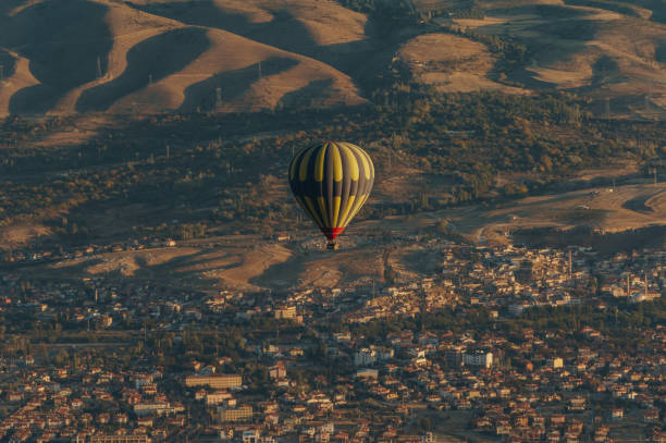 aerial view of hot air balloon over fairy chimneys, Cappadocia, Turkey