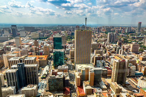 This pic shows aerial view of Johannesburg city  skyline at day time. The pic is is taken in sunny day and in march 2019. The pic shows Johannesburg cityscape and downtown.