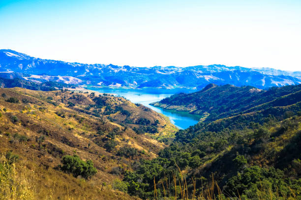 Aerial view of Lake Casitas Reservoir with blue sky and mountain on the background. Ventura County, California, USA stock photo