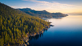 istock Aerial View of Lake Tahoe Shoreline with Mountains and Turquoise Blue Waters 1302742624