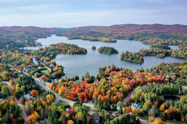 Aerial View of Laurentian's Landscape in Autumn at Sunset, Quebec, Canada Aerial View of Laurentian's Landscape in Autumn at Sunset. Village of St-Adolphe d’Howard and Lac Saint-Joseph, Quebec, Canada boreal forest stock pictures, royalty-free photos & images