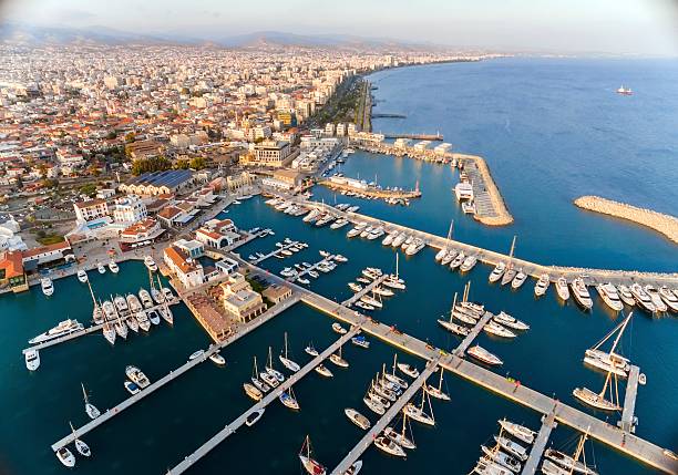 Aerial view of Limassol Marina, Cyprus Aerial view of the beautiful Marina in Limassol city in Cyprus, the beach, boats, piers, villas, commercial area, old port (palio limani) and Molos. A very modern, high end and newly developed space where yachts are moored and it's perfect for a waterfront promenade. cyprus island stock pictures, royalty-free photos & images