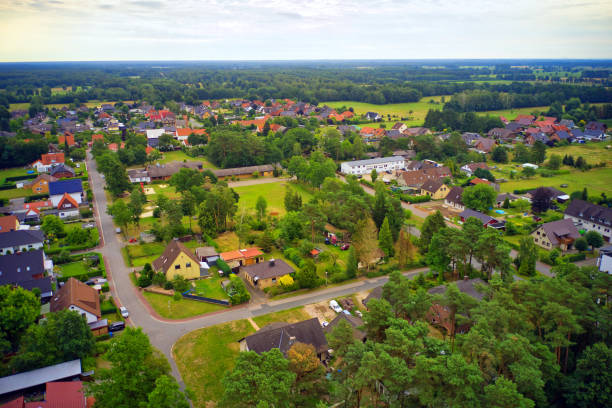 Aerial view of loosely built suburb in flat landscape of northern Germany stock photo