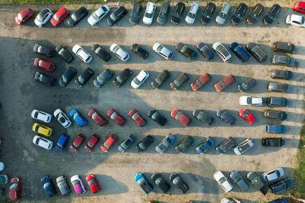 Aerial view of many colorful cars parked on dealer parking lot for sale stock photo