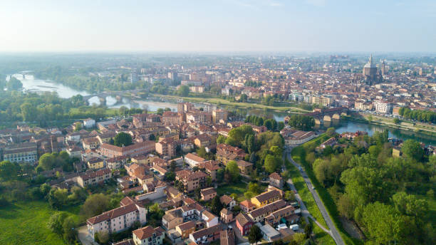 Aerial view of Pavia and the Ticino River, View of the Cathedral of Pavia, Covered Bridge and the Visconti Castle. Lombardia, Italy stock photo
