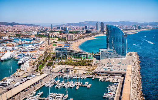 Front of Barcelona from the air with the port vell, the business center and the hotel