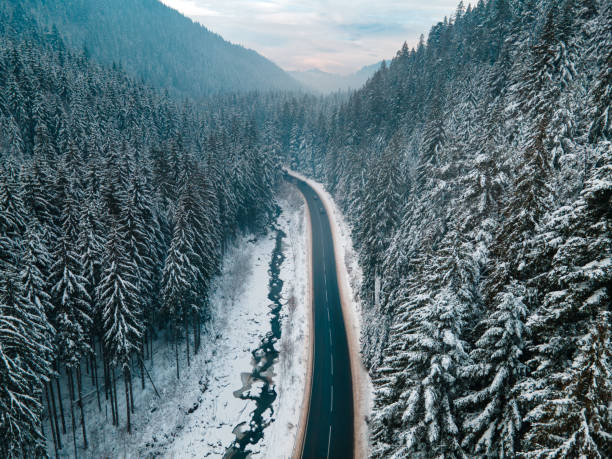 aerial view of road in winter carpathian mountains stock photo