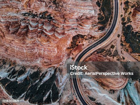 istock Aerial View of Rural Road through Danxia Landform 1318302821