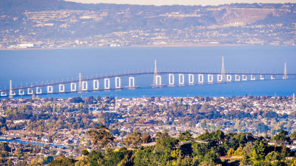 Aerial view of San Mateo Bridge, connecting the Peninsula and East Bay; residential areas of Foster City visible in the foreground ; San Francisco Bay Area, California stock photo