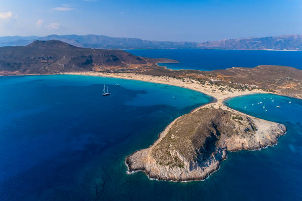 Aerial view of Simos beach in Elafonisos island in Greece. Aerial view of Simos beach in Elafonisos island in Greece. Elafonisos is a small Greek island the Peloponnese with idyllic exotic beaches and crystal clear waters. Laconia, Greece, Europe peloponnese stock pictures, royalty-free photos & images