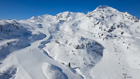 Aerial view of skiers on ski slopes in Obertauern ski resort, Salzburger Land of Austria.