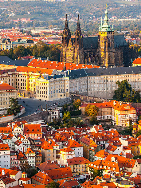 Aerial view of St Vitus Cathedral and Castle in Prague St Vitus Cathedral - landmark of Prague Castle historical complex. Aerial view from Petrin Hill Lookout Tower in the evening sunset time. Prague capital city of Czech Republic, Europe. UNESCO World Heritage Site hradcany castle stock pictures, royalty-free photos & images