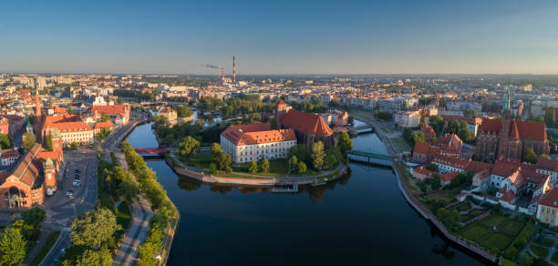 Aerial view of the city Sand (Piasek) Island and western part of the city of Wroclaw at morning Aerial view of the city Sand (Piasek) Island and western part of the city of Wroclaw at morning. Beautiful panorama of the historical city by the river, popular travel destination for tourists wroclaw photos stock pictures, royalty-free photos & images