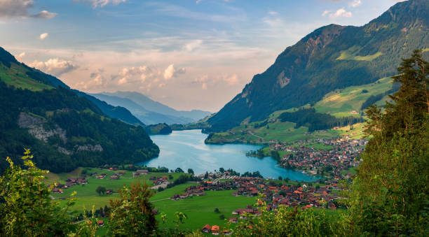 Aerial view of the Lake Lungern Valley in Switzerland Aerial view of the Lake Lungern Valley in Switzerland. Photographed from the viewing point Schoenbuehel.. lungern village switzerland lake stock pictures, royalty-free photos & images