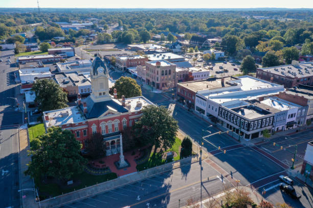 Aerial view of the Old Monroe Court house in NC Shot of the old Court House in the town square in Monroe North Carolina. View of the surrounding downtown city. small town stock pictures, royalty-free photos & images