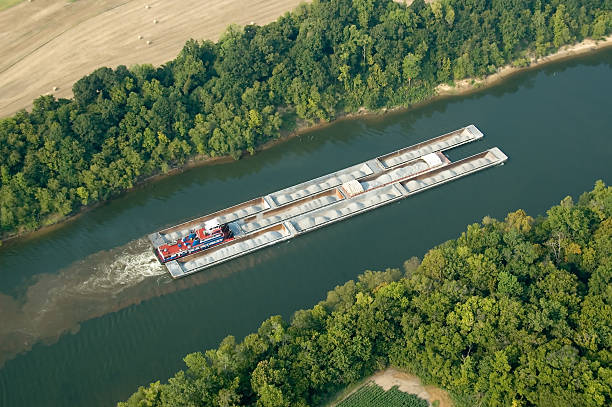 Aerial view of Tug and barges carrying gravel stock photo