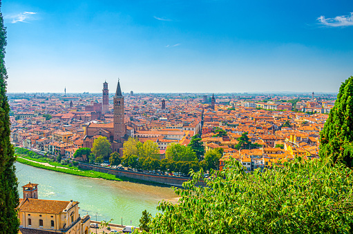 Aerial view of Verona historical city centre, Adige river, church Basilica di Santa Anastasia tower, medieval buildings with red tiled roofs, Veneto Region, Italy. Verona cityscape, panoramic view.