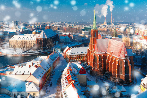 Aerial view of Wroclaw in the winter morning Aerial view of Ostrow Tumski with church of the Holy Cross and St. Bartholomew from Cathedral of St. John in the winter snowy morning in Wroclaw, Poland wroclaw stock pictures, royalty-free photos & images