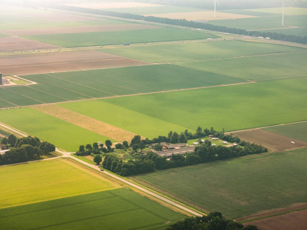 Aerial view on agriculture landscape in Flevoland, The Netherlands Aerial view on agriculture landscape in Flevoland province, The Netherlands flevoland stock pictures, royalty-free photos & images