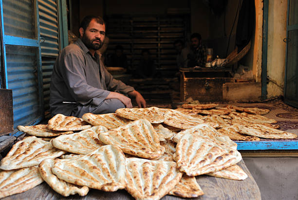 Afghan bread seller, Kabul's market / bazaar stock photo