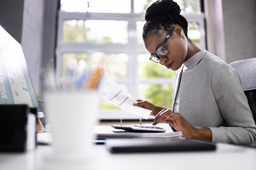 african-american-accountant-or-auditor-picture-id1338373163?b=1&k=20&m=1338373163&s=170667a&w=0&h=B1xgdVwhyldLED68DXSrp0HejfTmK0xst1hgImA1loI=