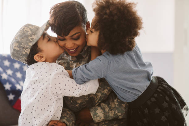 African - American Army Mom African-American army mom is back home. soldiers returning home stock pictures, royalty-free photos & images