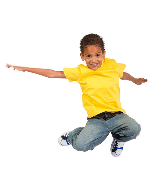 african american boy jumping african american boy jumping over white background boy jumping stock pictures, royalty-free photos & images