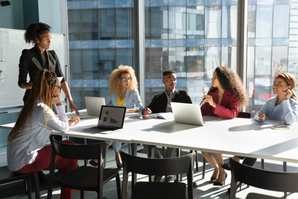 African American businesswoman head meeting with colleagues stock photo