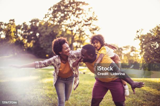 African American family having fun outdoors.