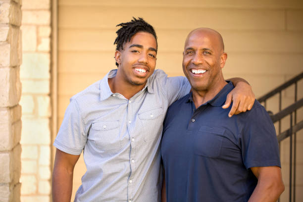 African American father and his son. stock photo