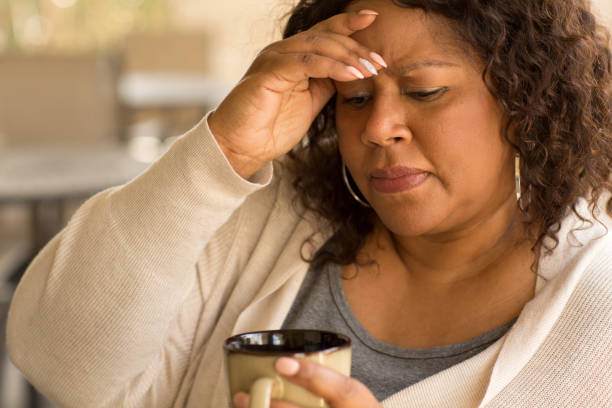 African American middle age woman looking sad. stock photo