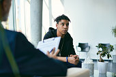 istock African American teenager having psychotherapy session at psychologist's office. 1331029398