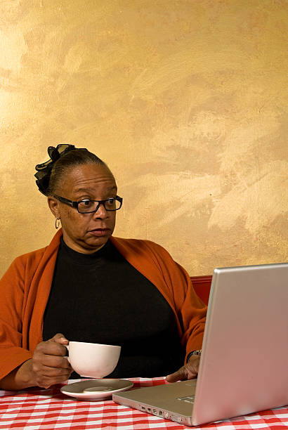 African American Woman drinking coffee stock photo