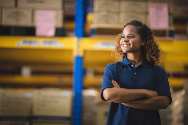 African American worker person working with safety in warehouse logistic factory, business manufacturing industry occupation concept, goods product box distribution stock photo