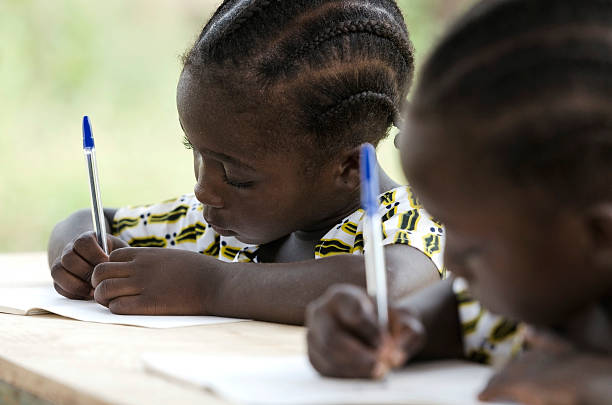 African Children at School Doing Homework stock photo