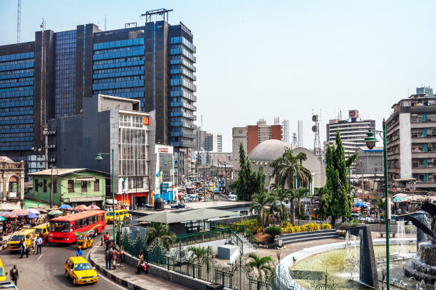 African city - Lagos, Nigeria Lagos, Nigeria: Tinubu Square on Lagos Island - surrounded by high-rise buildings, park and fountain in the middle. lagos nigeria stock pictures, royalty-free photos & images