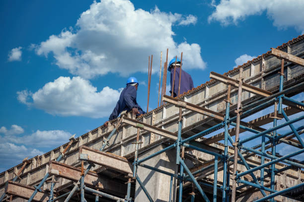 african construction workers climbed on the scaffolding stock photo