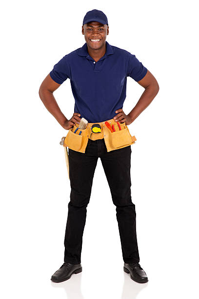 african craftman with tool-belt portrait of professional african craftsman with tool-belt african american plumber stock pictures, royalty-free photos & images