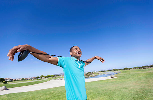 African golfer having a good laugh stock photo