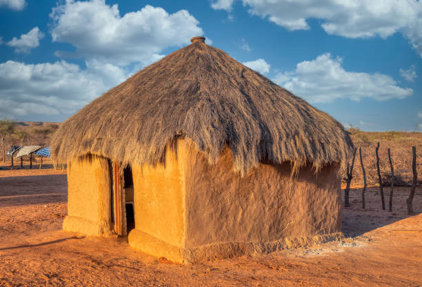 African house with thatched roof stock photo