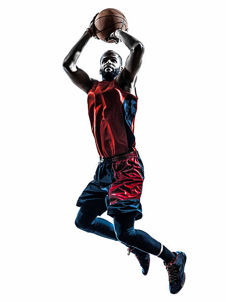 african man basketball player jumping throwing silhouette - basketbalspeler stockfoto's en -beelden