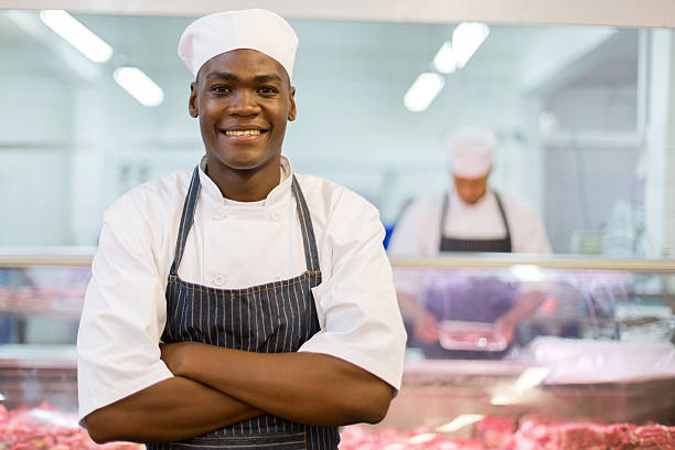 afro american butcher arms folded stock photo
