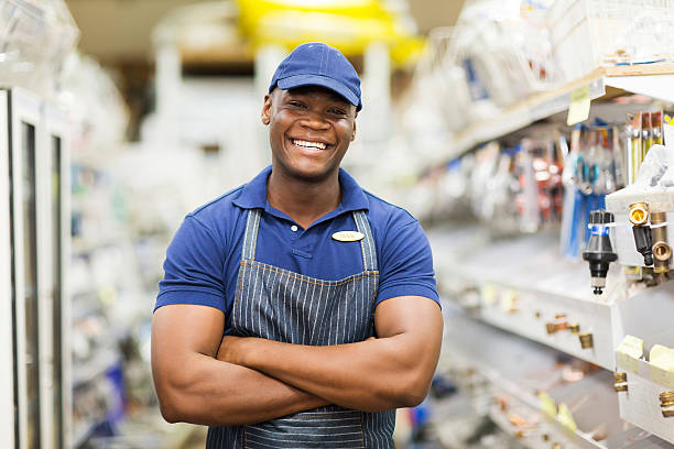 afro american hardware worker with arms crossed stock photo