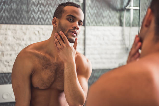 261 Mirror Looking Naked Men Stock Photos, Pictures & Royalty-Free Images -  iStock