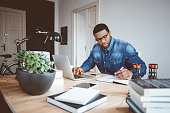 istock Afro american young man working at home office 670540864