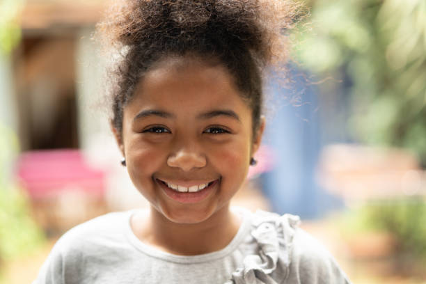 Afro child smiling portrait I am really happy latina girl stock pictures, royalty-free photos & images