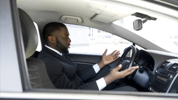 Afro-American man getting angry and nervous because of car breakdown, stress Afro-American man getting angry and nervous because of car breakdown, stress ignition stock pictures, royalty-free photos & images