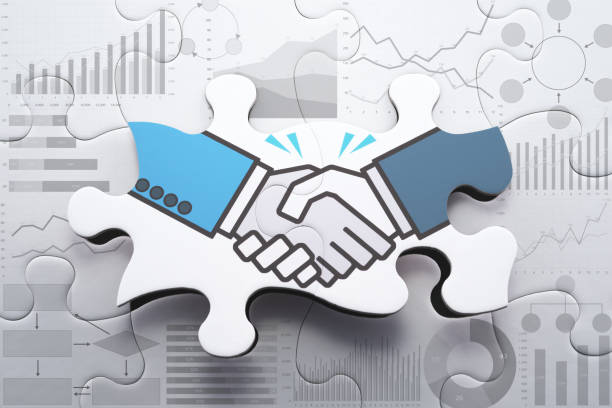 Agreement, consensus building and strategic partnership concept. Analyzing data for finding business solution. Assembling handshake jigsaw puzzle. business relationship stock pictures, royalty-free photos & images
