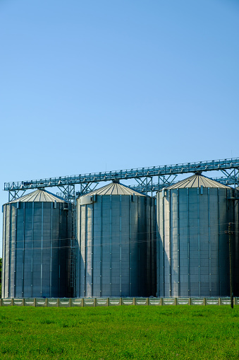 Agricultural Silos. Building for storage and drying of grain crops. Agribusiness concept.